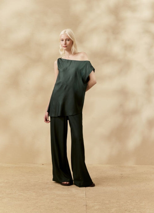 ASSYMETRICAL LOOP BLOUSE